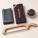 The Breadly Care Kit beside the Breadly bow bread knife