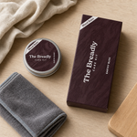 The Breadly Care Kit styled on a beech counter with linen